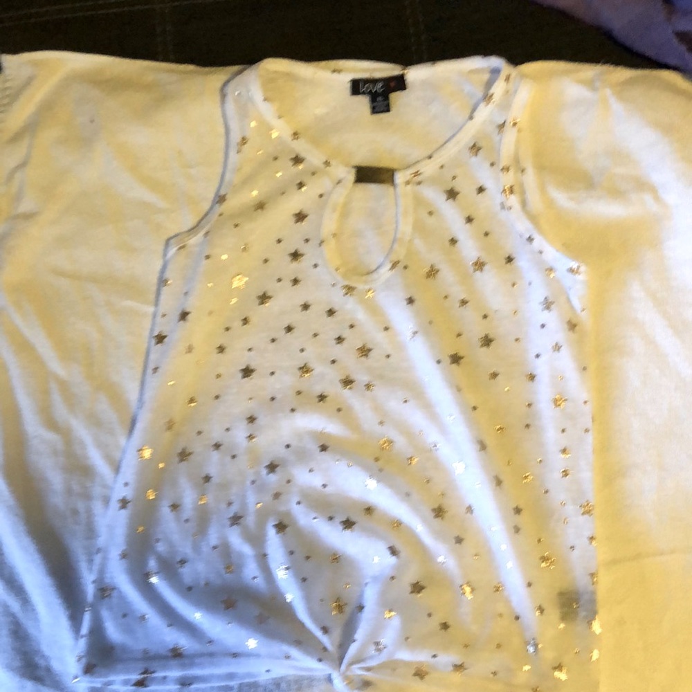 White sleeveless blouse with gold stars